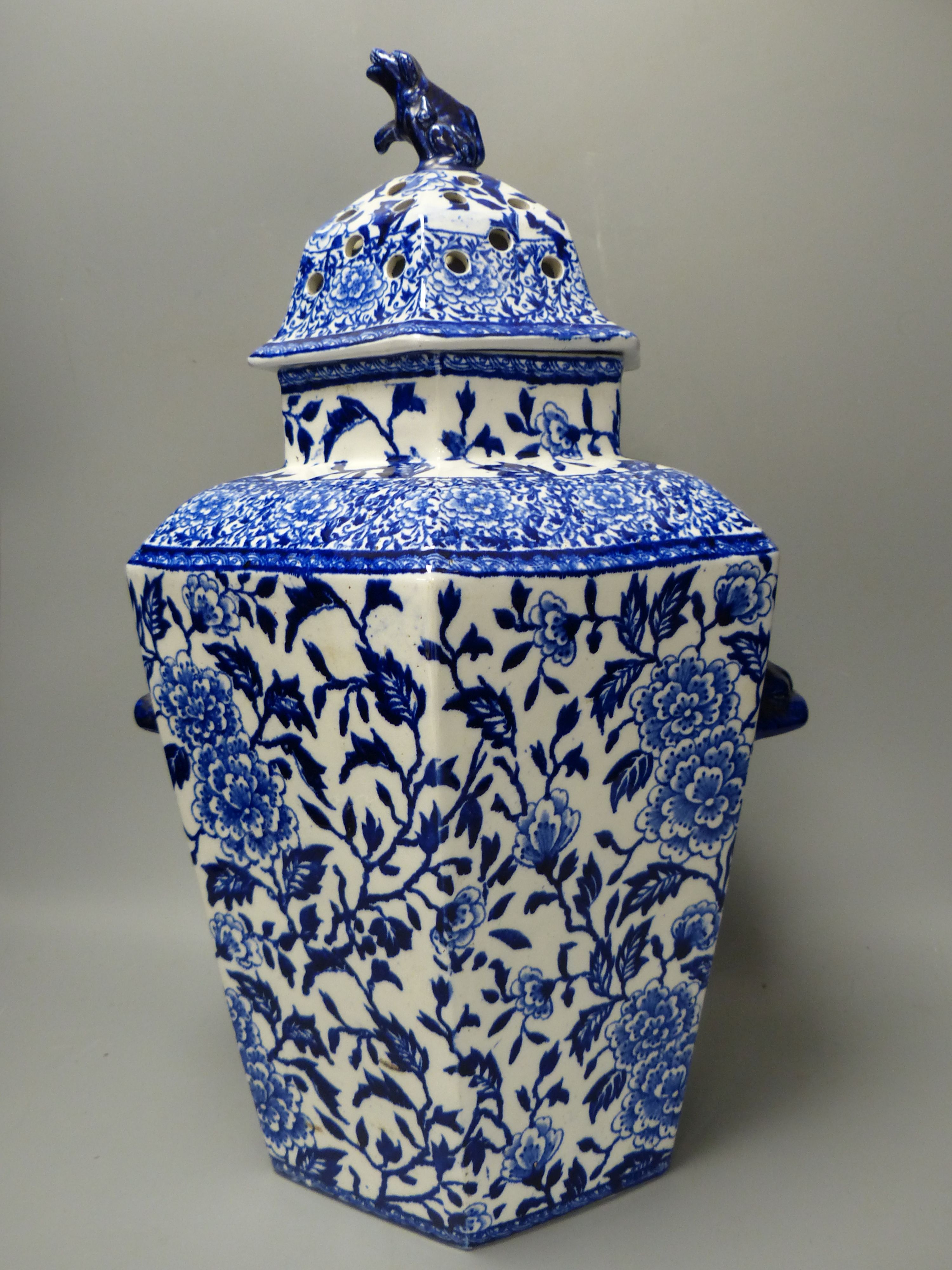 A pair of large early 20th century blue printed pottery pot pourri vases and covers, height 36cm